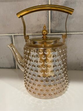Elegant Gold Glass Teapot with Textured Dot Design